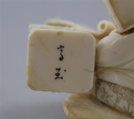 Two Japanese ivory okimono of bijin, Meiji period, 15cm.